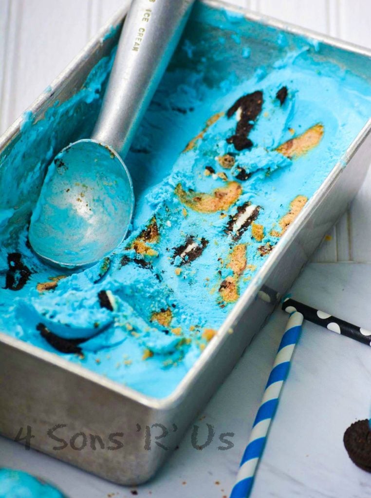 Cookie Monster Ice Cream shown in a metal tin with a silver ice cream scoop