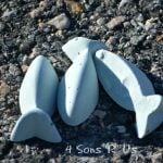 homemade purple sidewalk chalk laying on asphalt