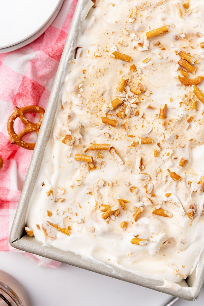 salted caramel pretzel ice cream in a metal loaf pan