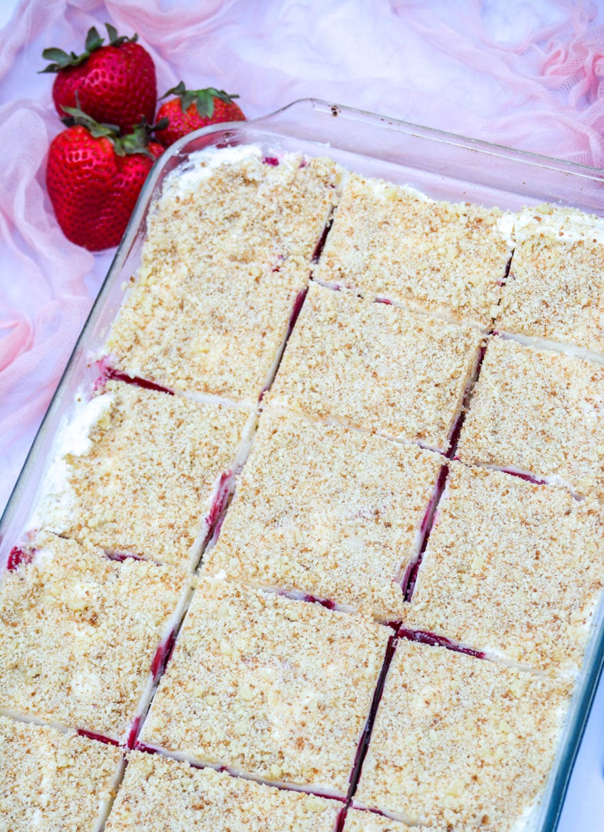 strawberry crunch bars in a 9x13" pyrex casserole dish cut into squares