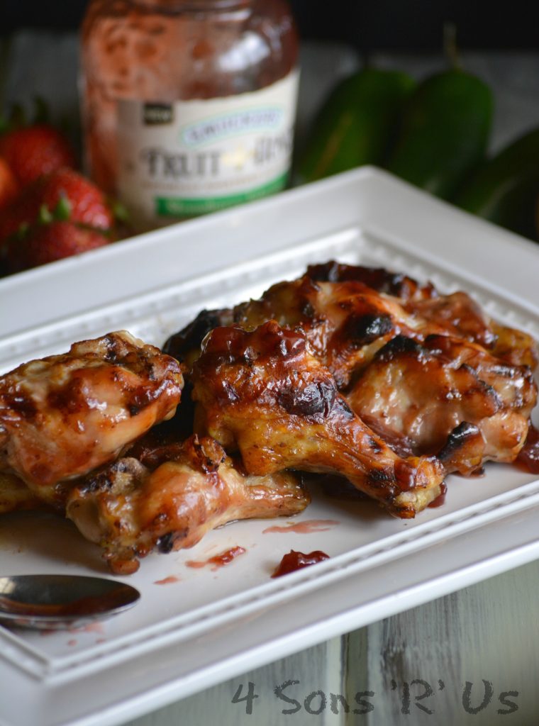 strawberry jalapeno wings on a white serving platter