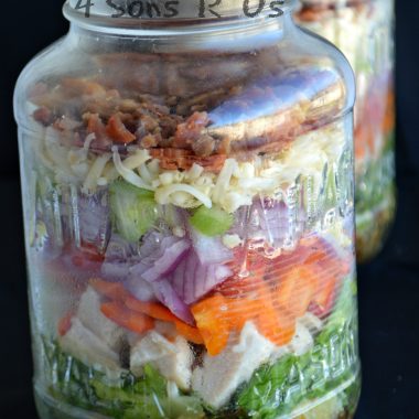 a layered salad in a mason jar