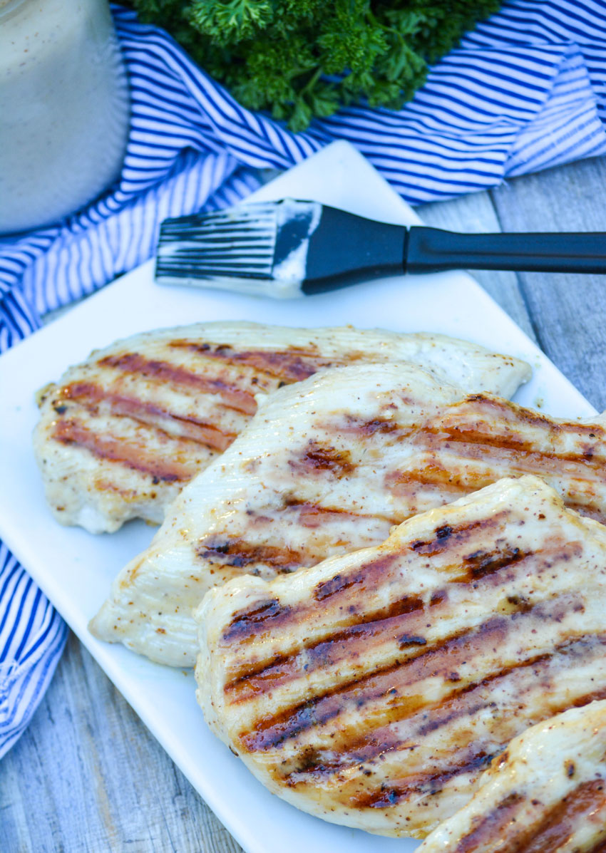 grilled chicken spread with white barbecue sauce