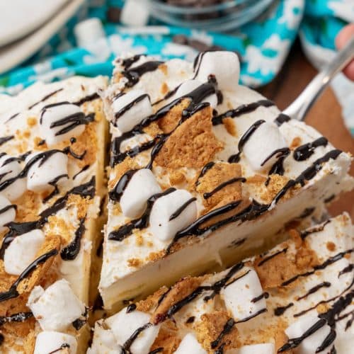 a silver spatula lifting up a slice of s'mores ice cream pie
