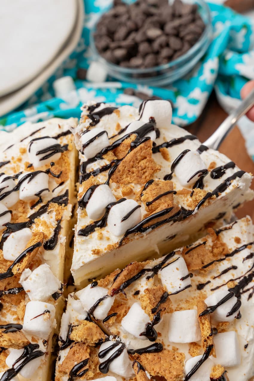 a silver spatula lifting up a slice of s'mores ice cream pie