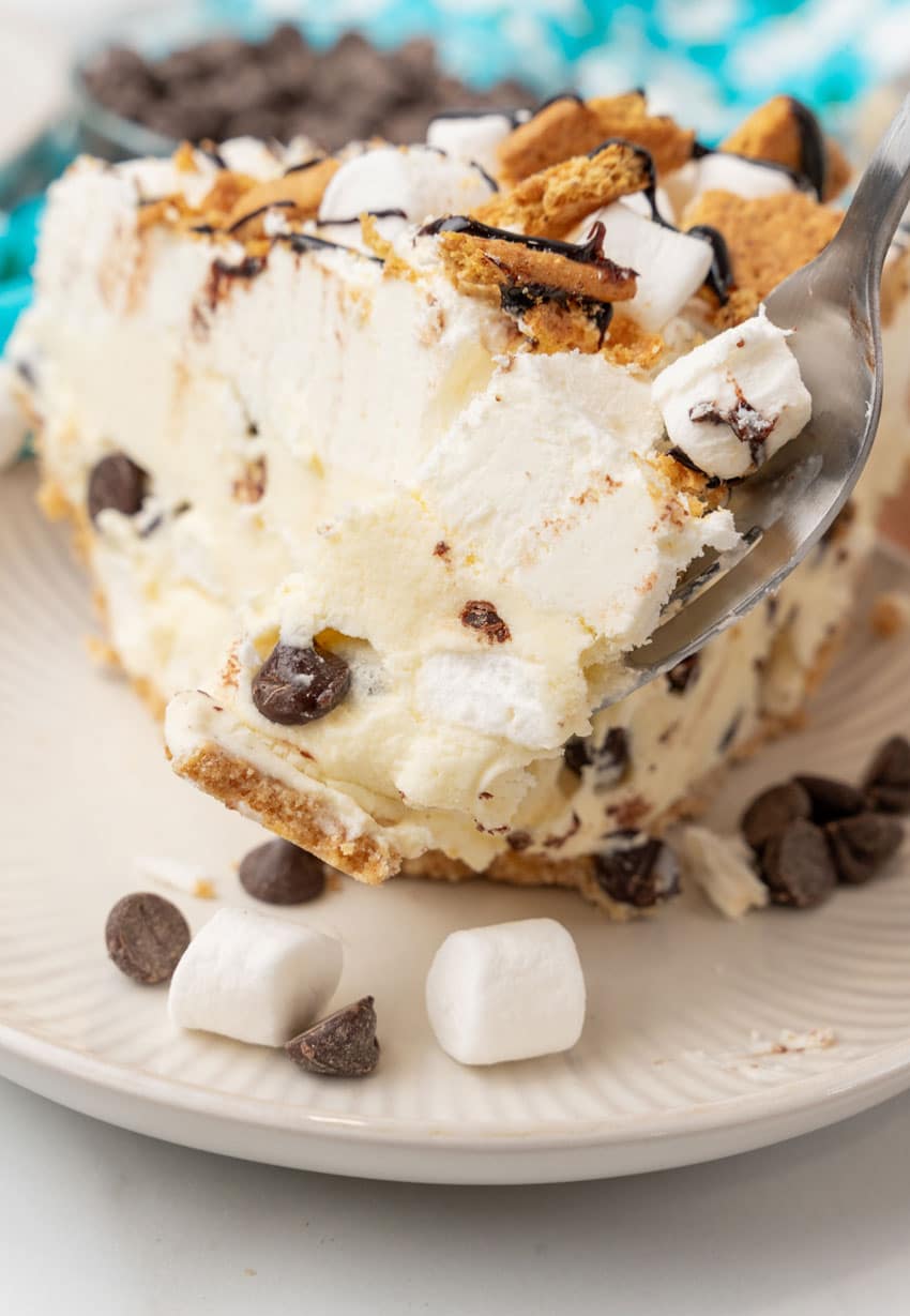 a silver fork lifting up a scoop of s'mores ice cream pie