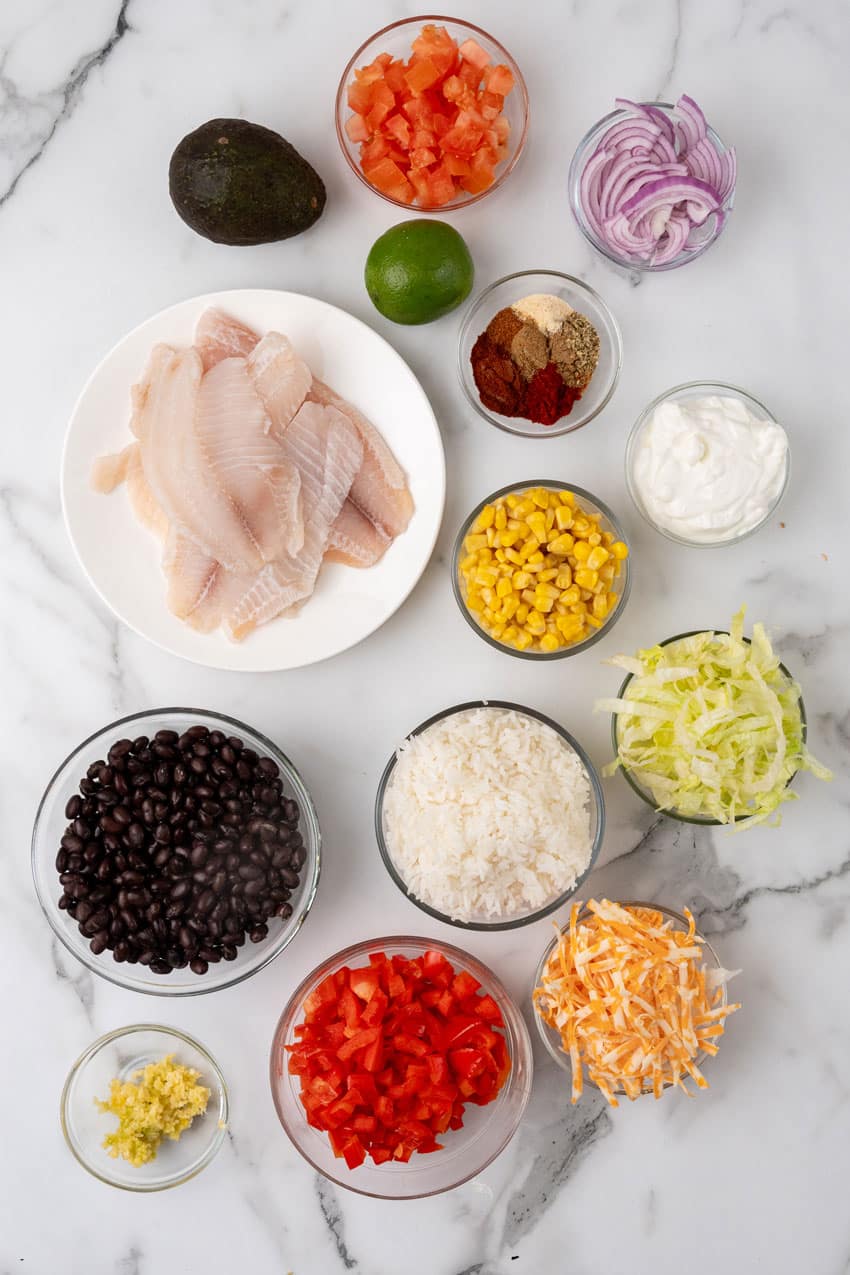 an overhead image showing the measured ingredients needed to make a blackened tilapia bowls