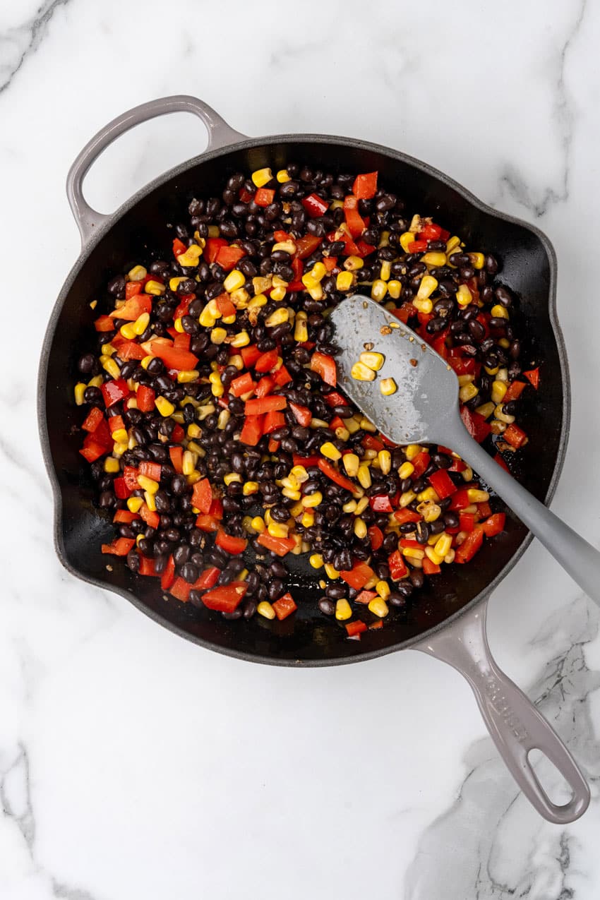 tex mex veggie blend sauteing in a black skillet