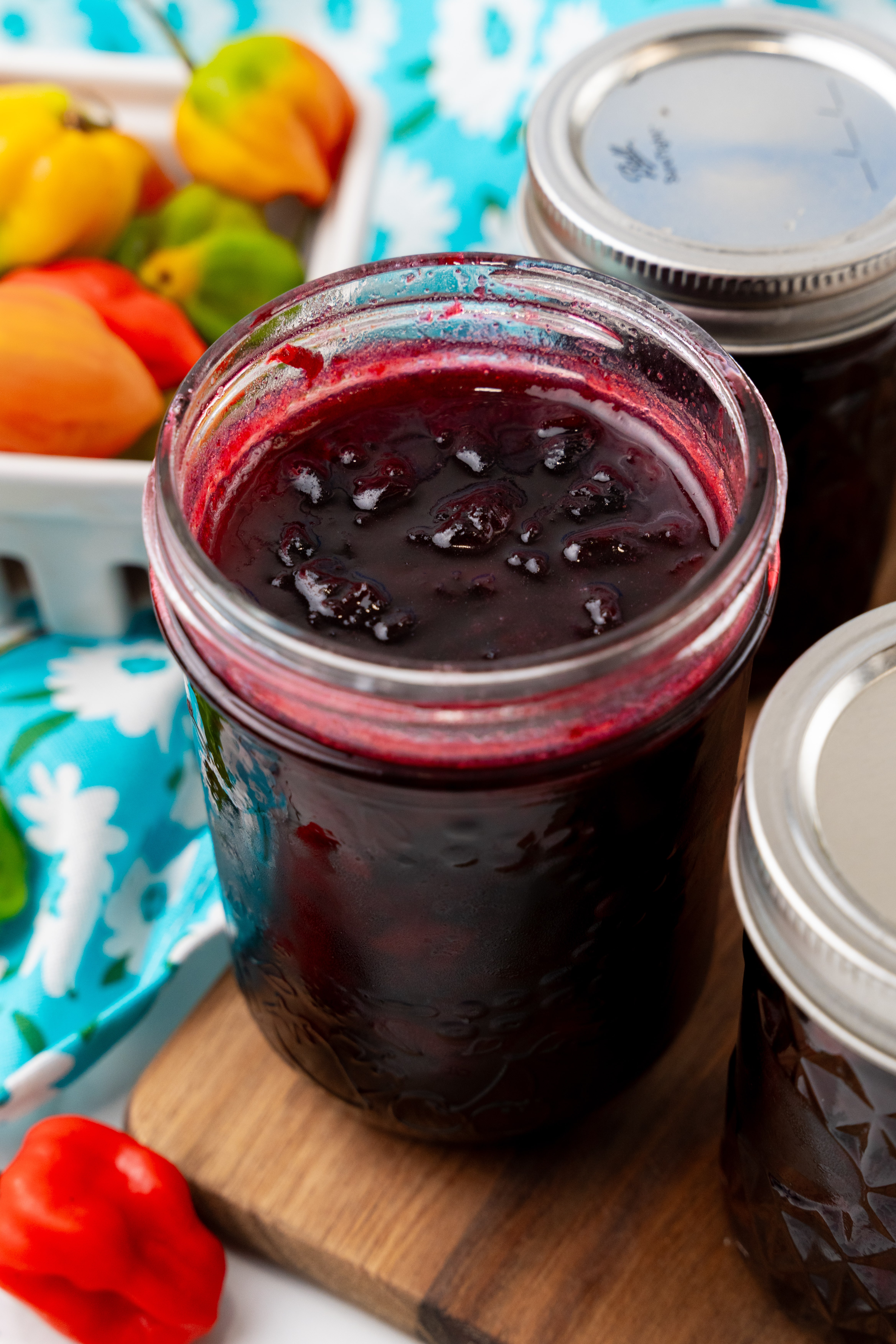 fresh cherry habanero jam in a small glass mason jar