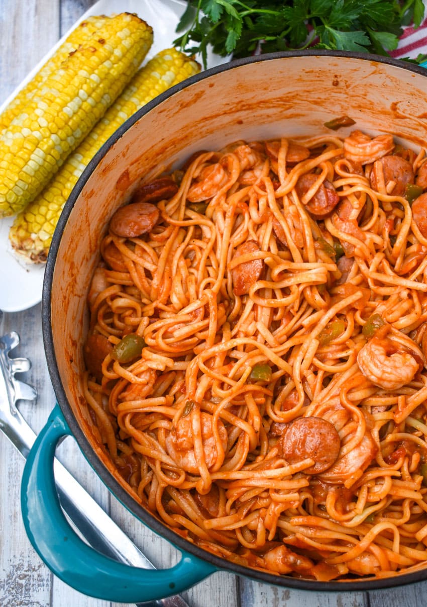jambalaya pasta in a large blue dutch oven