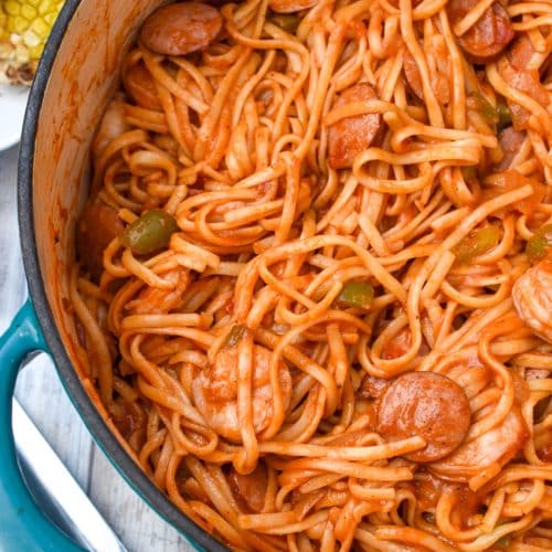 jambalaya pasta in a large blue dutch oven
