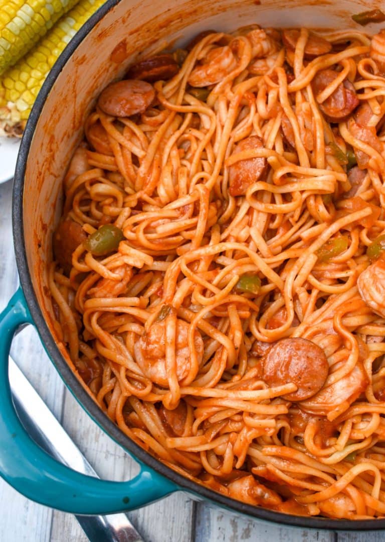 jambalaya pasta in a large blue dutch oven
