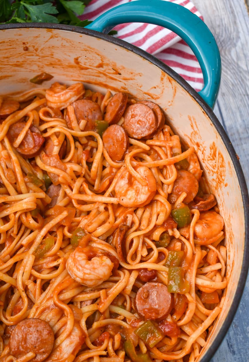 jambalaya pasta in a large blue dutch oven