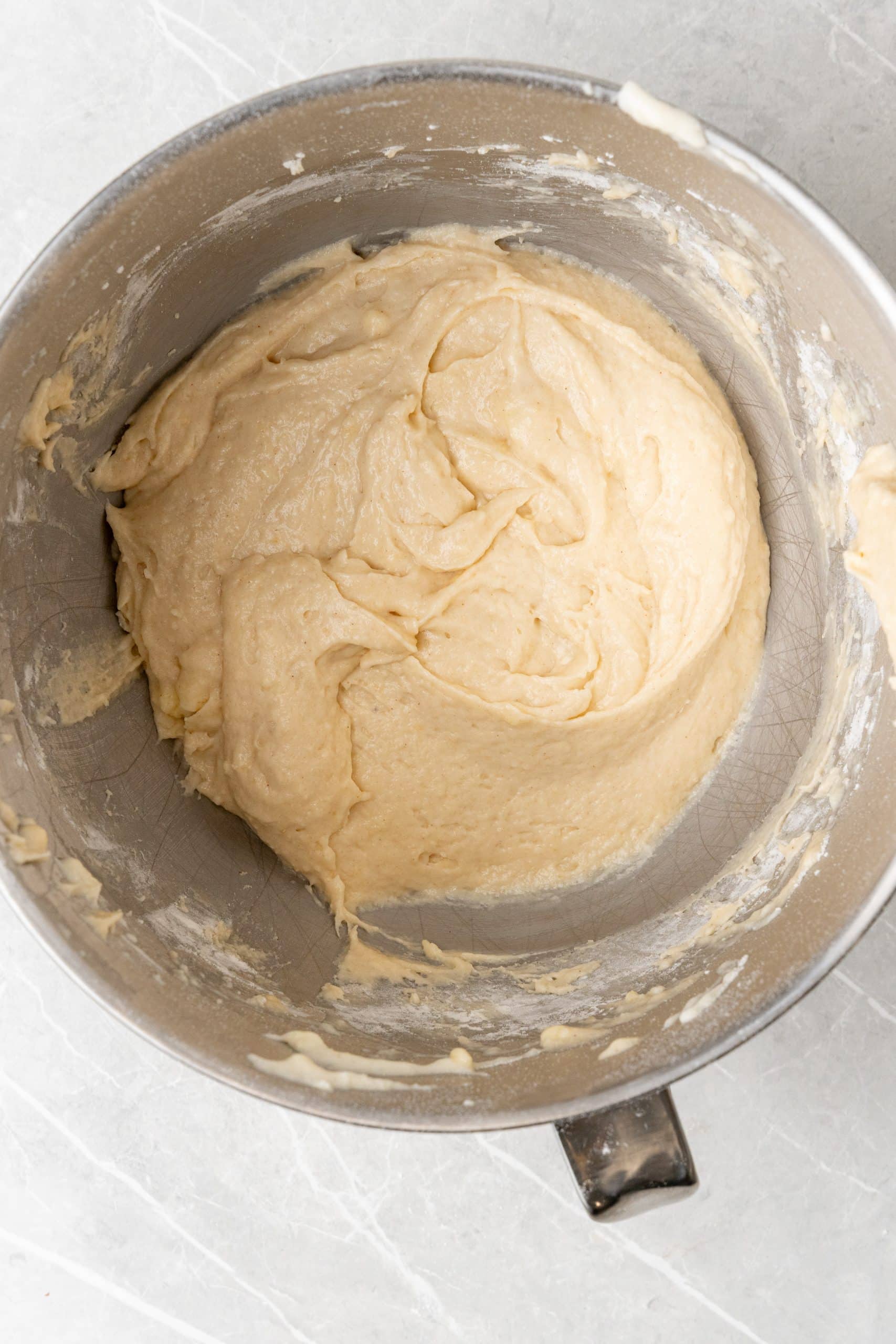 apple butter cupcake batter in the bowl of a stand mixer