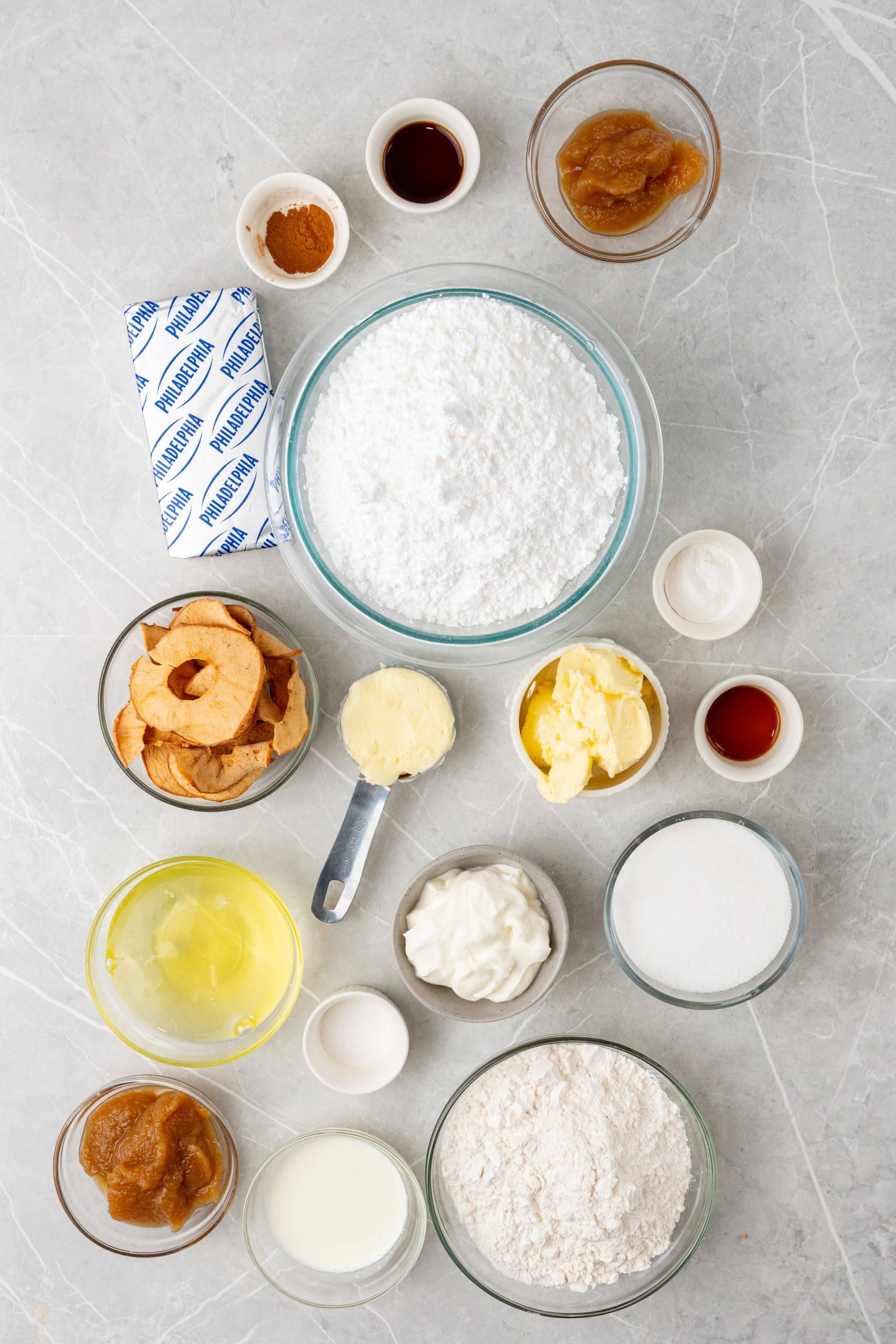 an overhead image showing the measured ingredients needed to make a batch of apple butter cupcakes