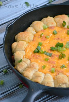 CHILI CHEESE DOG DIP WITH PULL APART PIGS IN A BLANKET IN A CAST IRON SKILLET