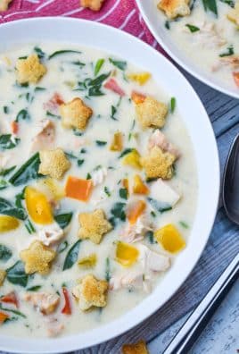 christmas confetti soup with homemade croutons in a shallow white bowl