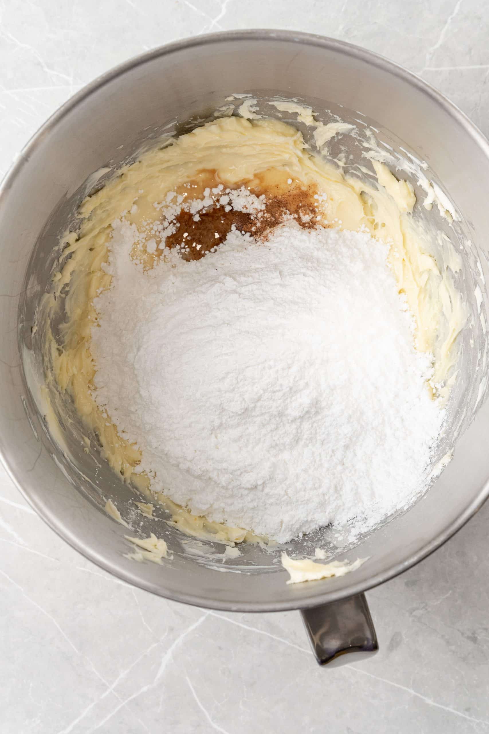 spiced white buttercream ingredients in the bowl of a stand mixer