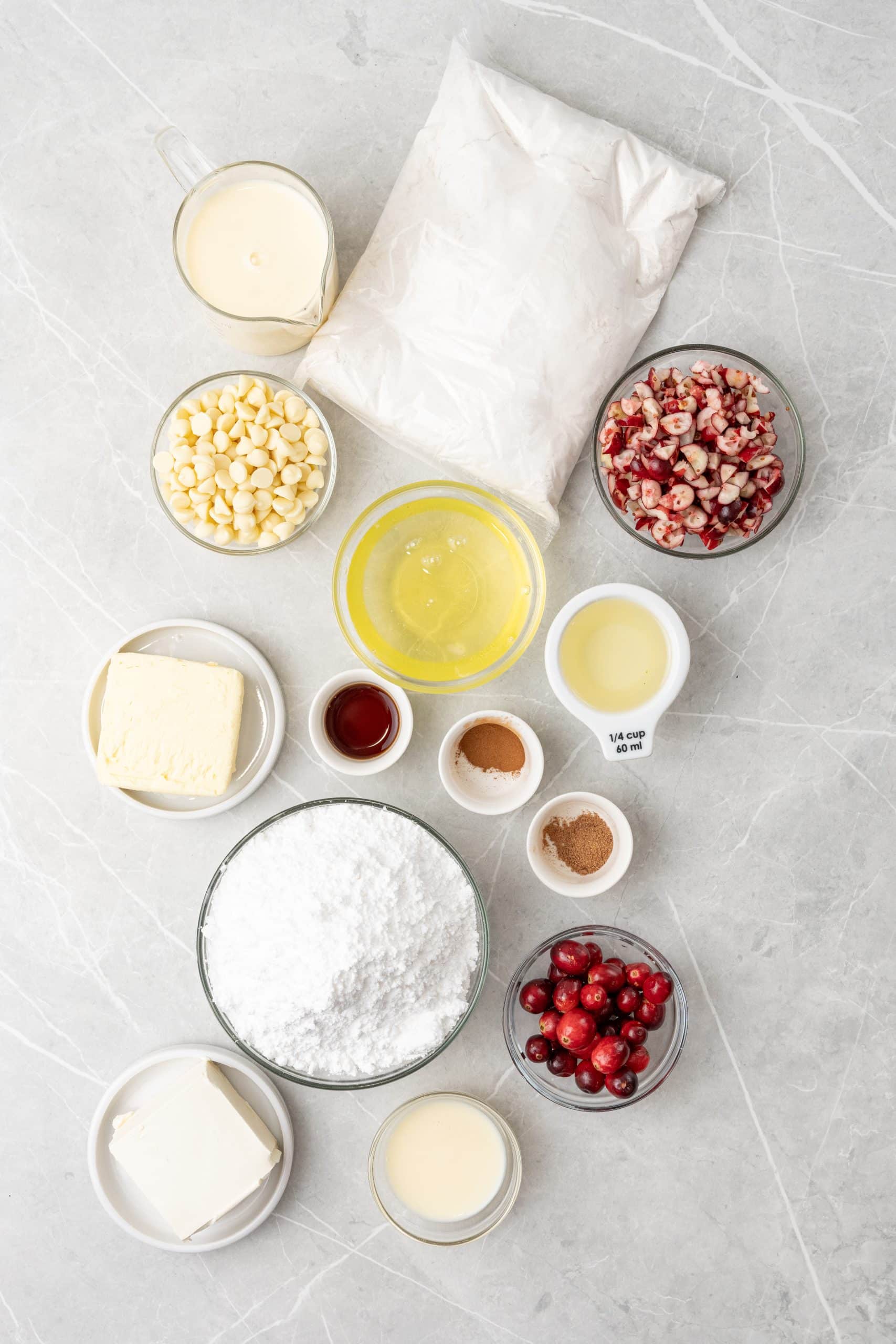 an overhead image showing the measured ingredients needed to make the cranberry eggnog cupcakes