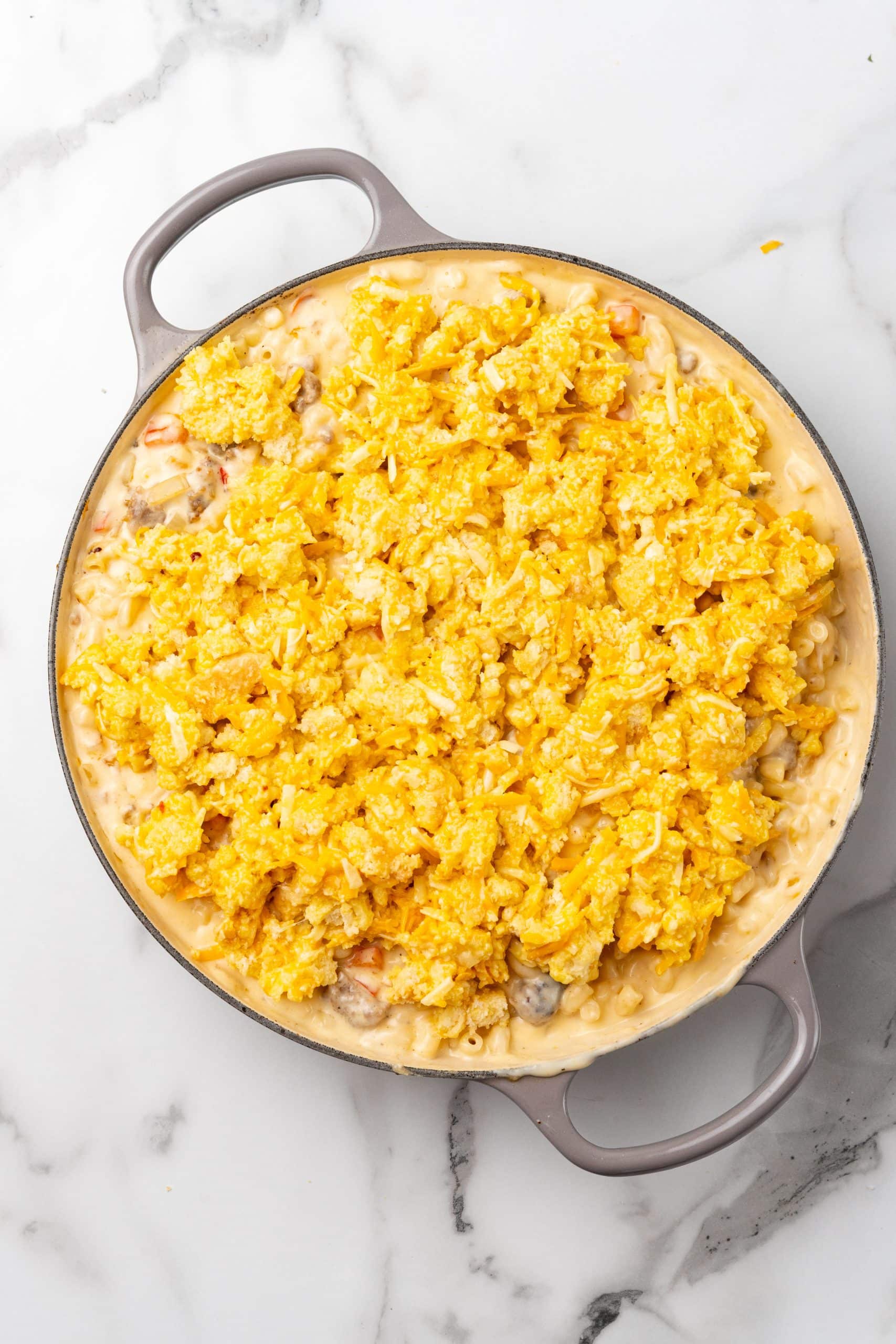 cheesy breakfast mac and cheese in a large gray cast iron skillet