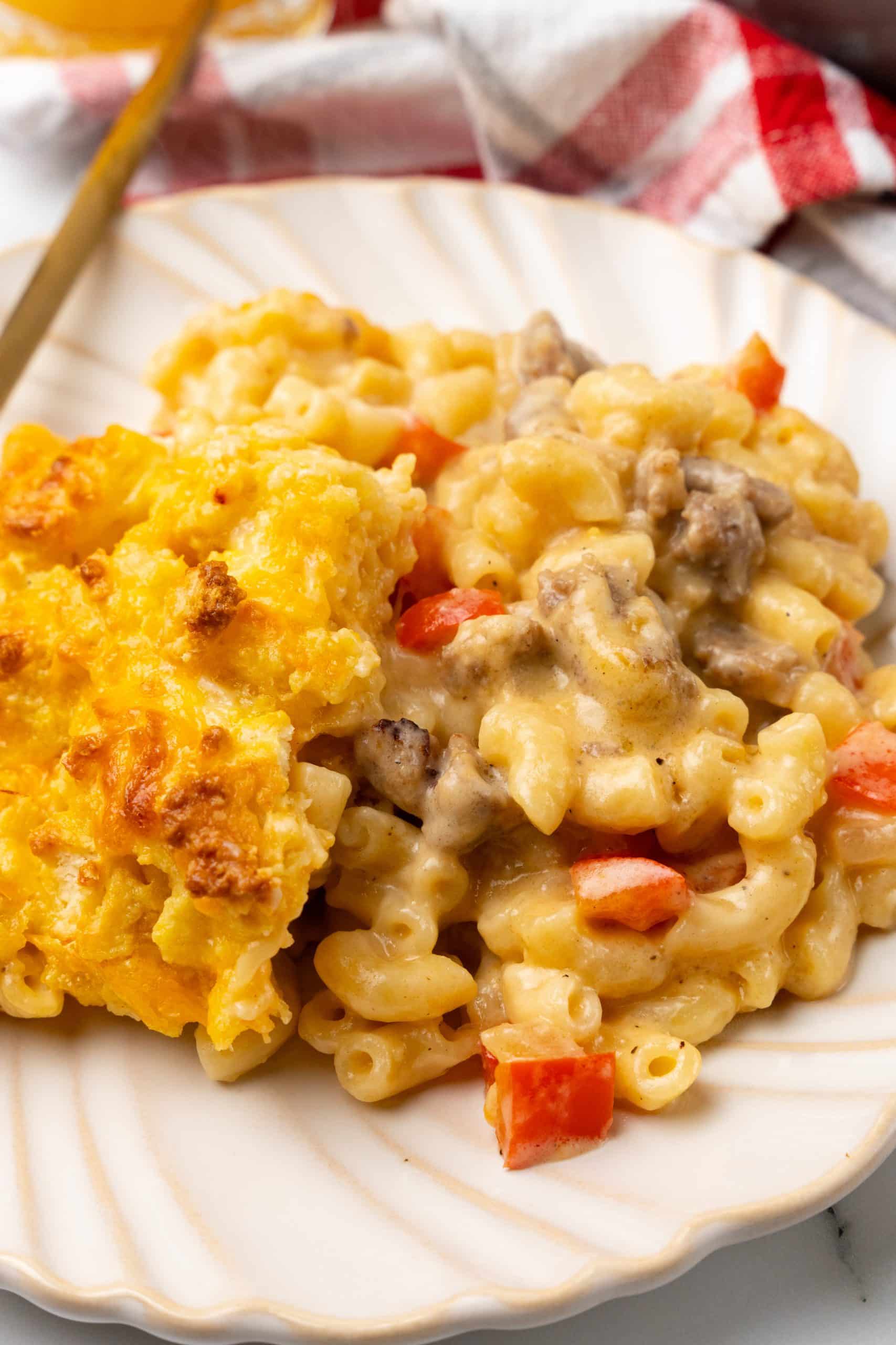 creamy breakfast mac and cheese on a white plate