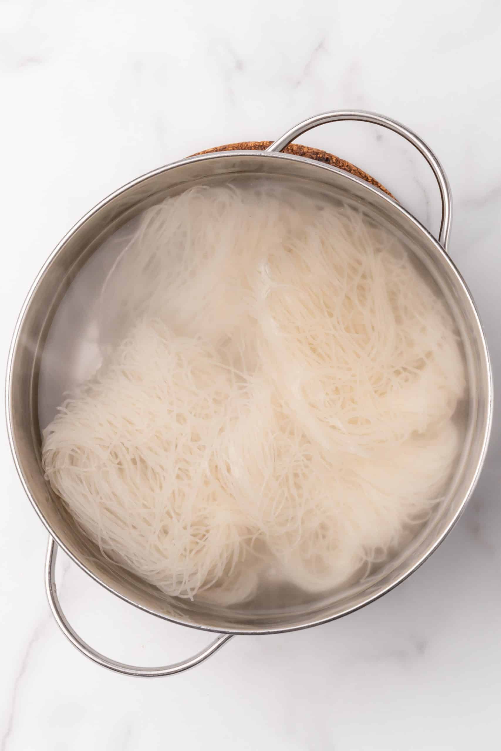 rice noodles in a pot of hot water