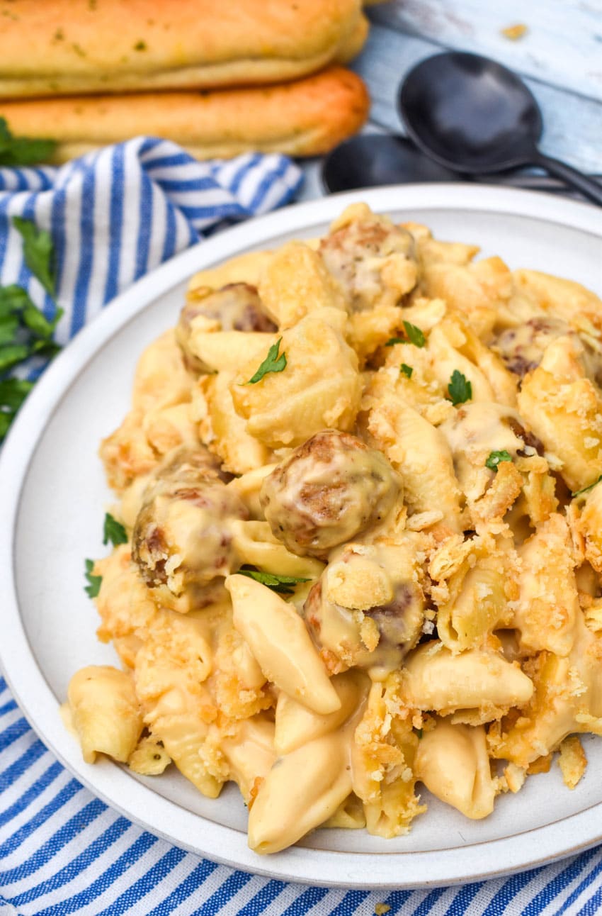 mac and cheese with meatballs on a white plate