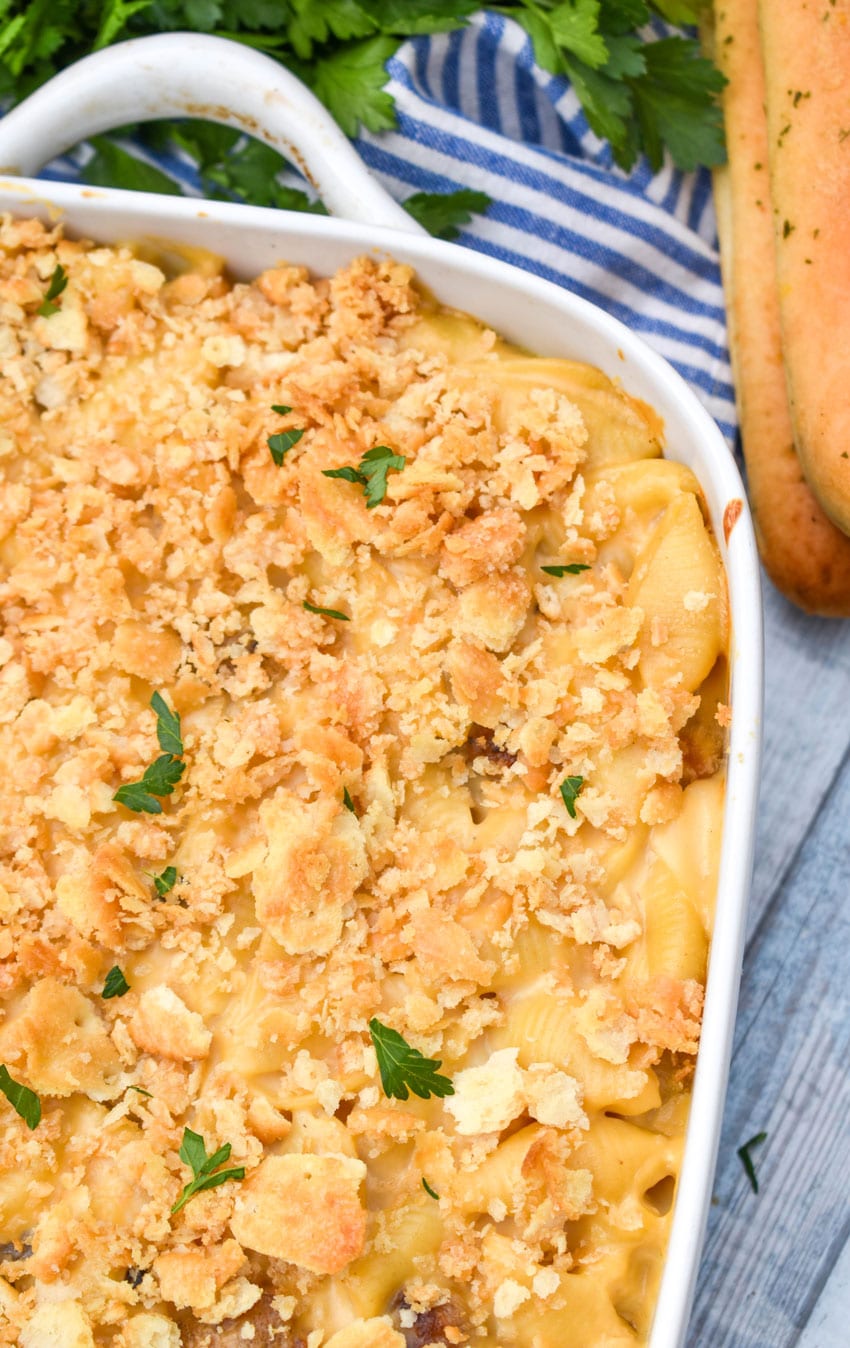 mac and cheese with meatballs in a white baking dish