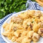 mac and cheese with meatballs on a white plate