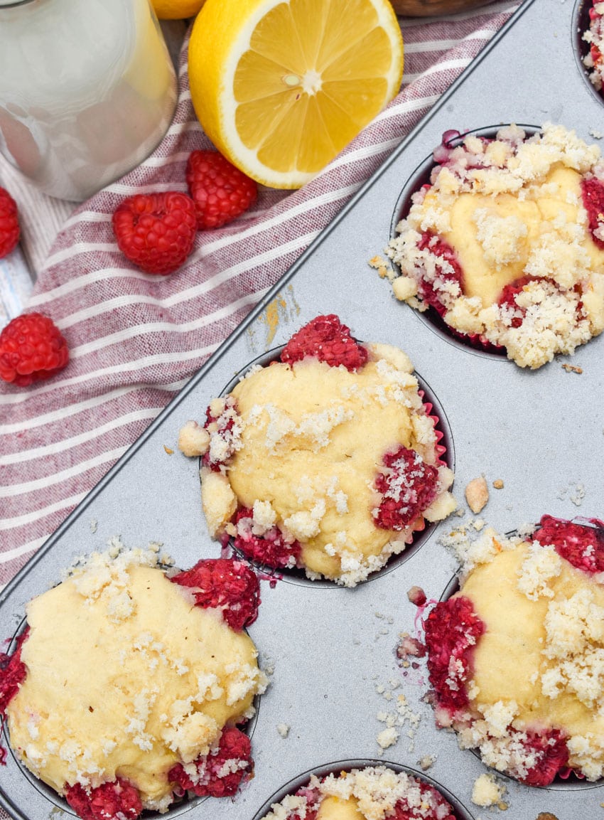 raspberry lemon yogurt muffins in a metal muffin pan