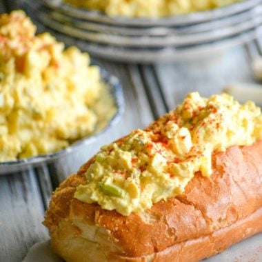 deviled egg salad served on top of a crispy baguette