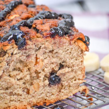 peanut butter and jelly banana bread on a wire cooling rack