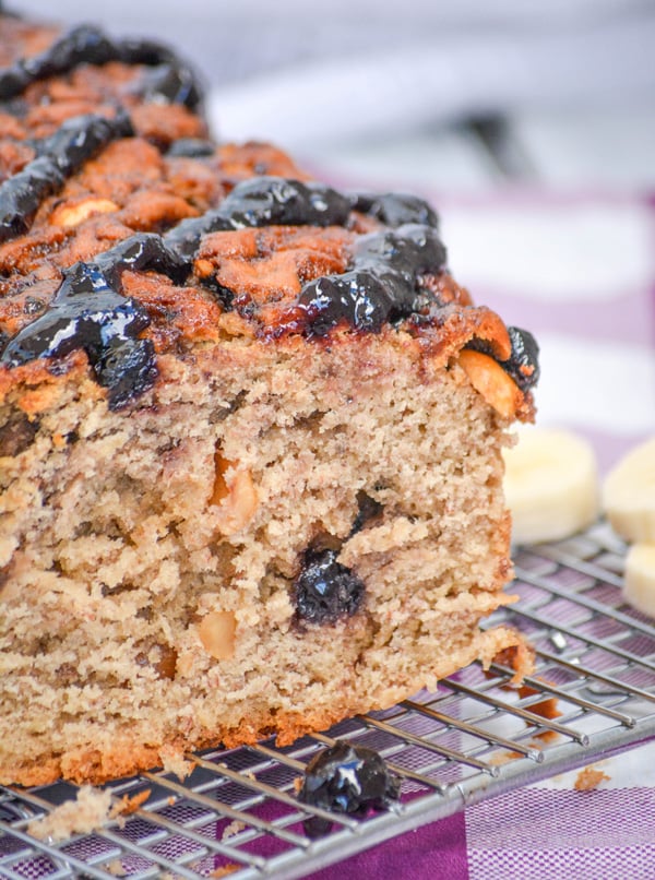 peanut butter and jelly banana bread on a wire cooling rack