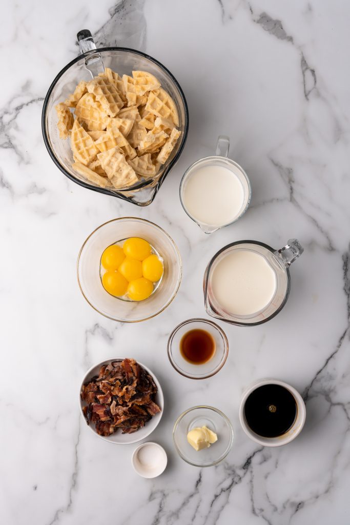 overhead image showing the measured ingredients needed for a batch of maple bacon waffle bread pudding