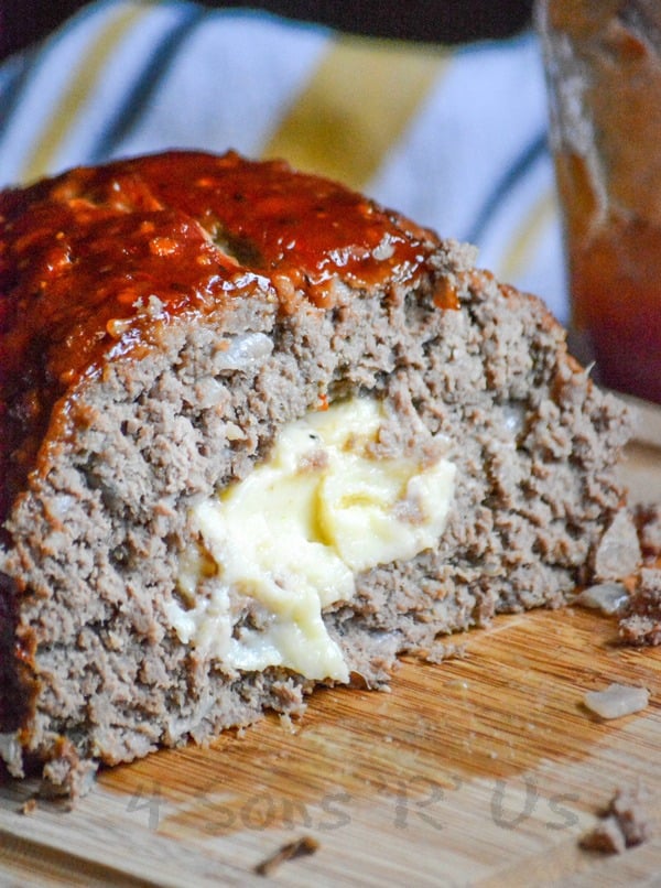 All Jack'd Up Stuffed Smoked Meatloaf cut open to show the melted cheesy center 