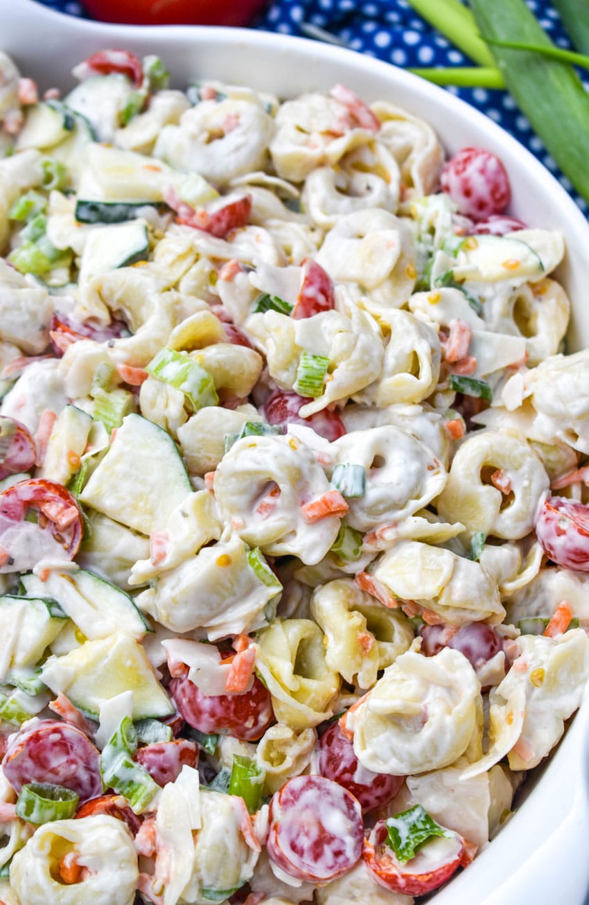 a close up of tortellini pasta salad with vegetables