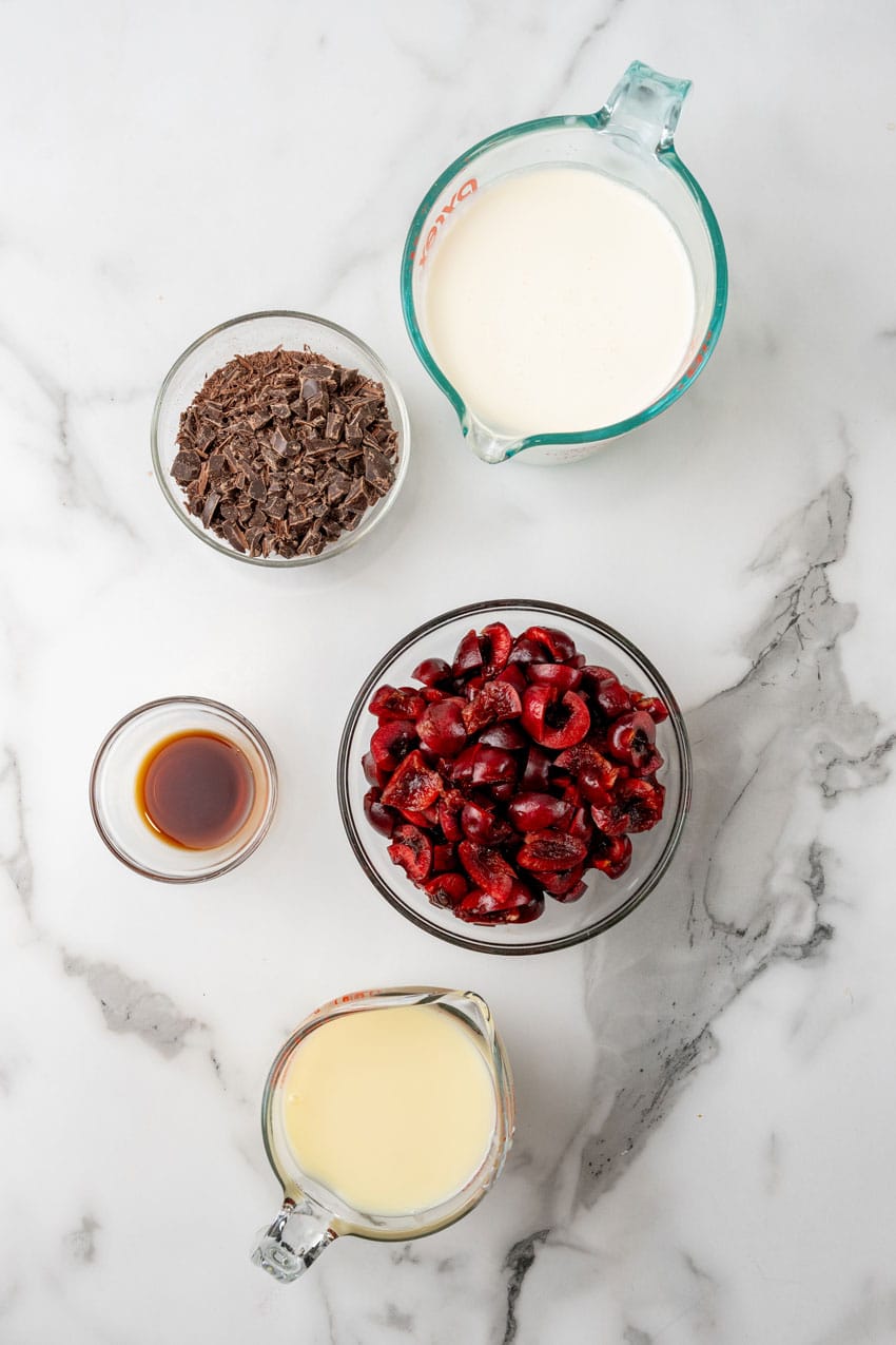 an overhead image showing the ingredients needed to make a batch of homemade ben & jerry's cherry garcia ice cream