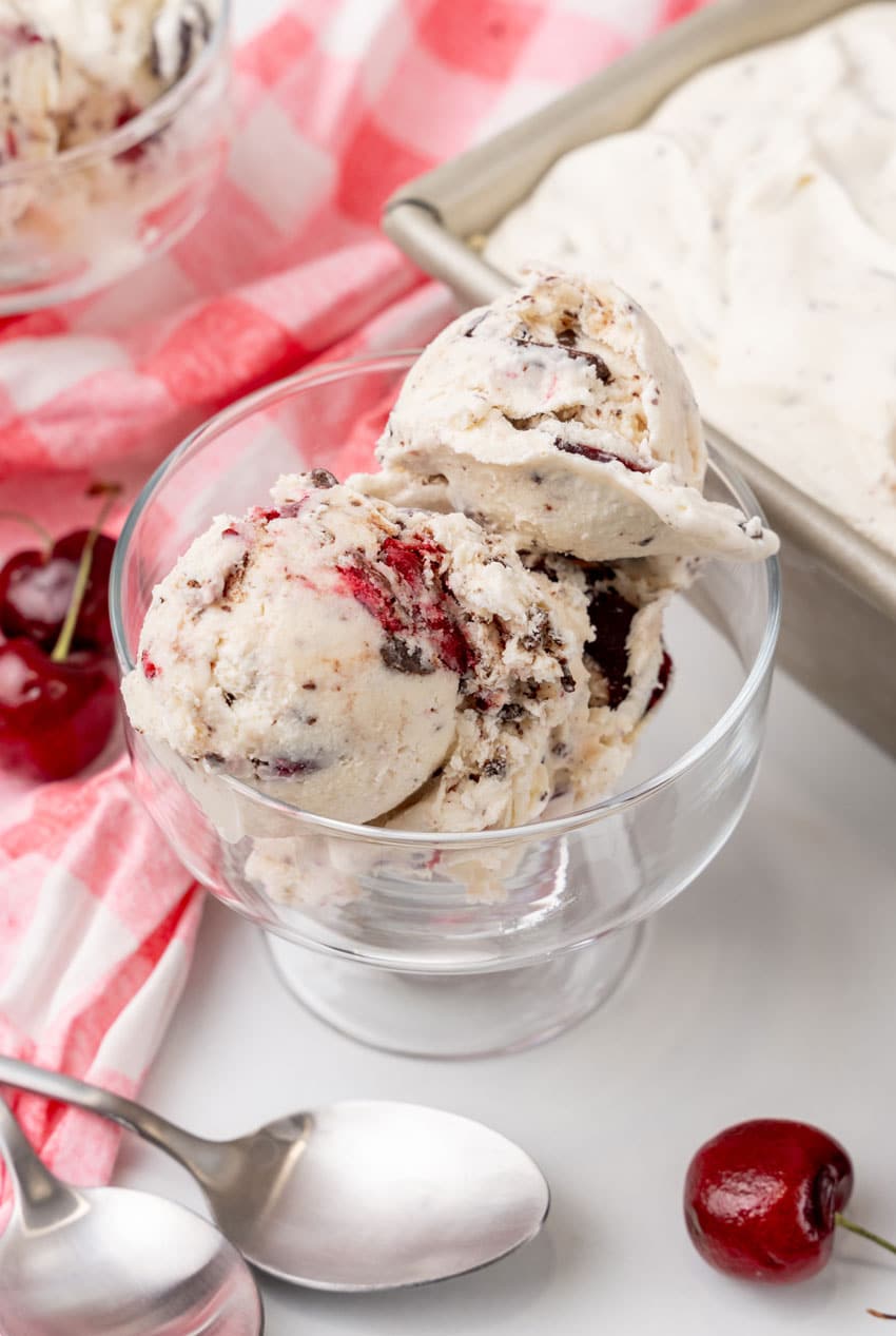 scoops of homemade cherry garcia ice cream in a small glass dish
