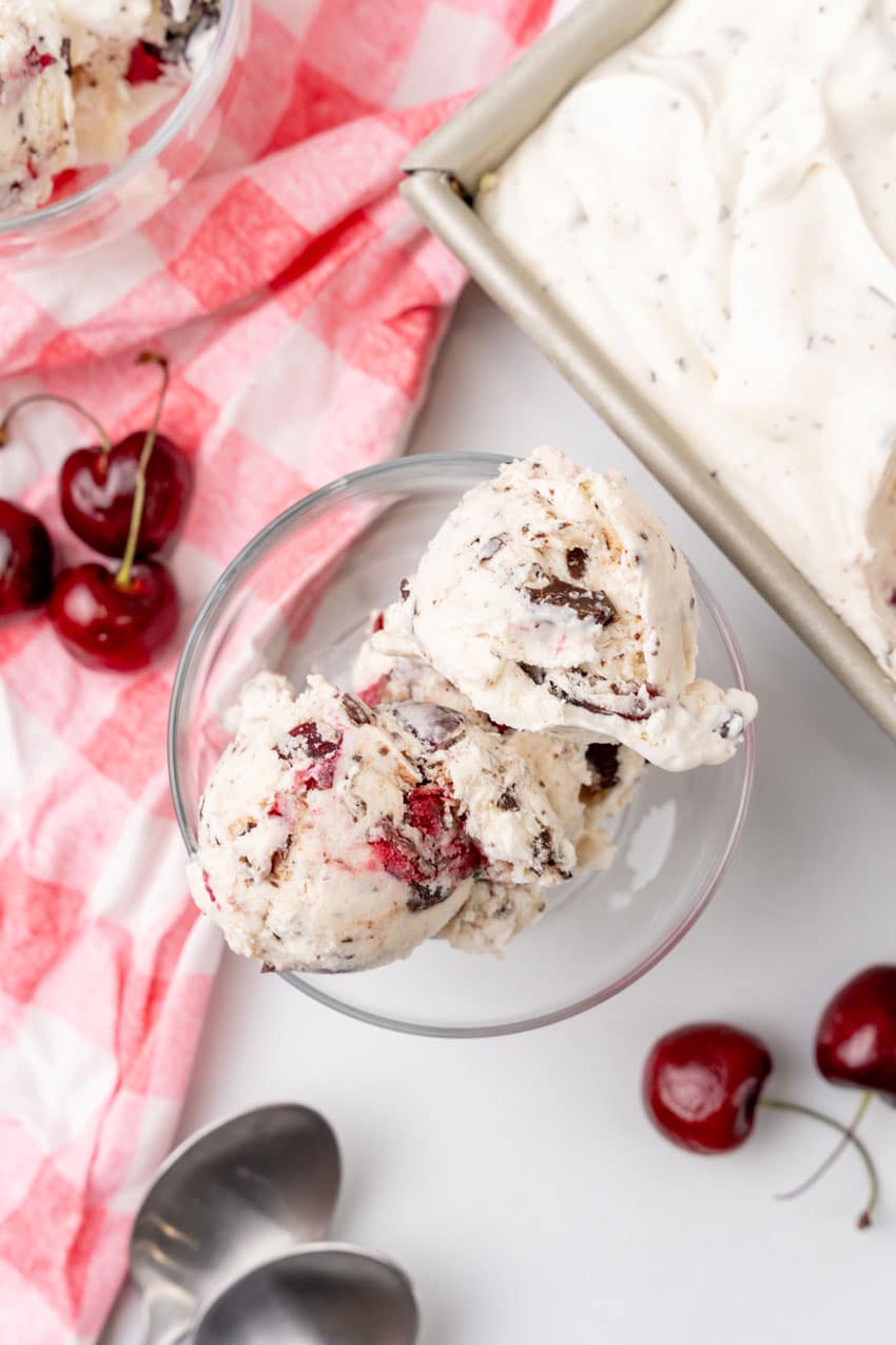 scoops of homemade cherry garcia ice cream in a small glass dish
