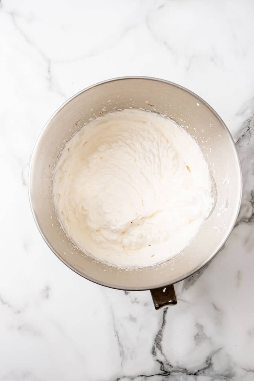 whipped heavy cream in the metal bowl of a stand mixer