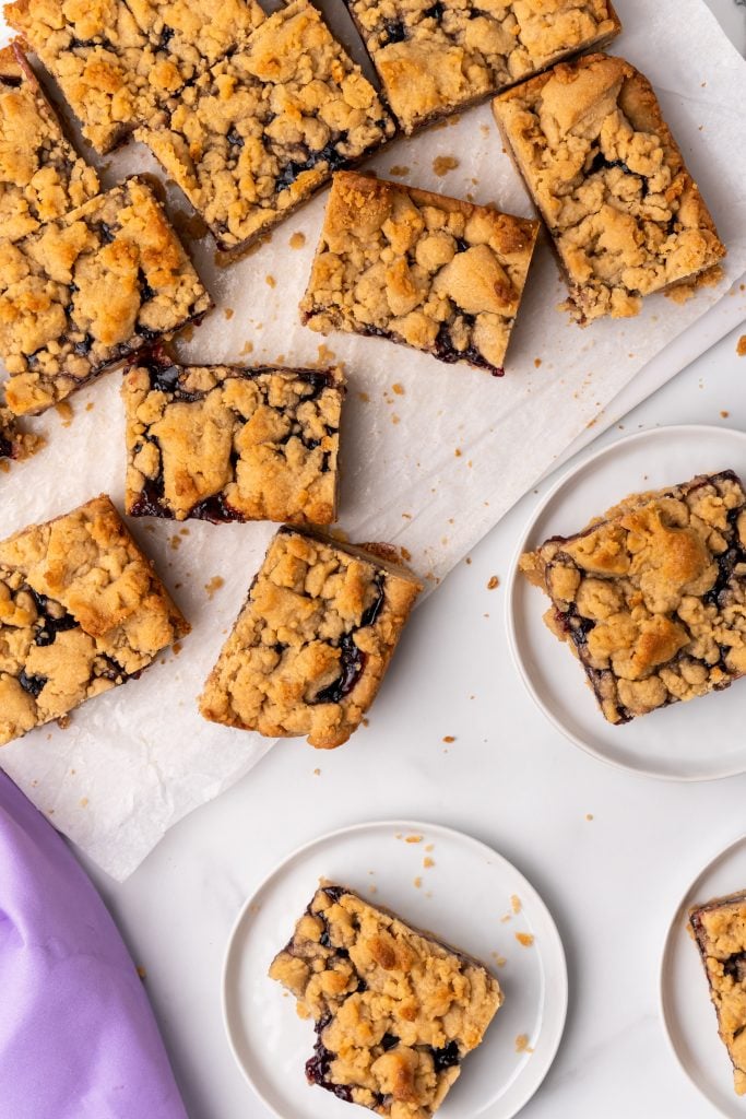 sliced peanut butter and jelly bars on parchment paper