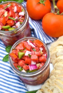 bruschetta style salsa in two glass mason jars