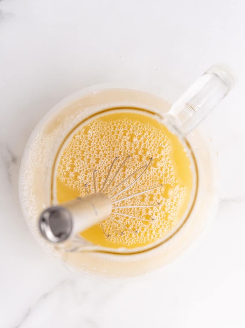 orange juice in a glass pitcher