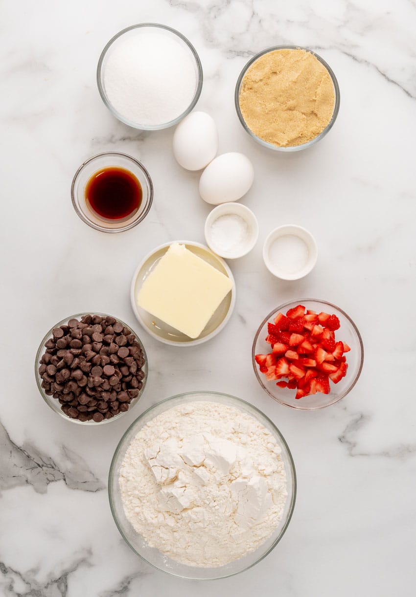 an overhead image showing the measured ingredients needed to make a batch of strawberry chocolate chip cookies