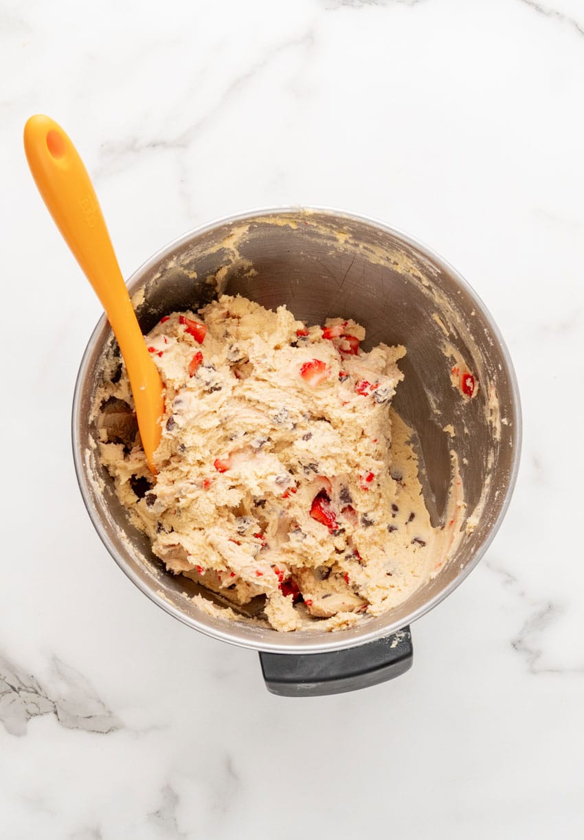 strawberry chocolate chip cookie batter in a metal mixing bowl