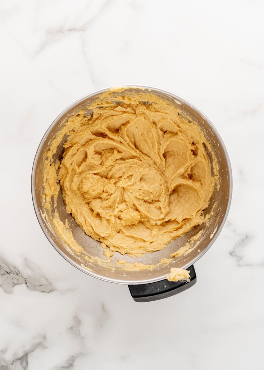 butter and sugar creamed together in a metal mixing bowl