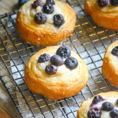 BLUEBERRY CREAM CHEESE DANISH ON A WIRE COOLING RACK