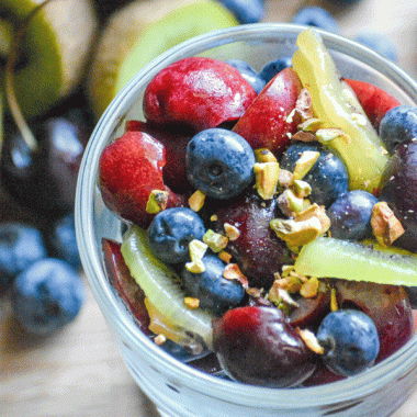 CHERRY BERRY FRUIT SALAD IN A SMALL GLASS DISH