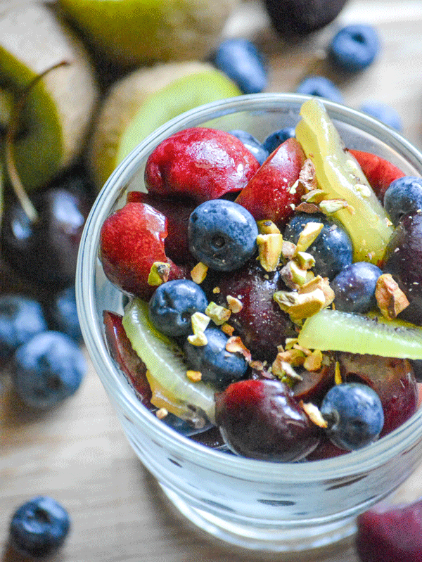 CHERRY BERRY FRUIT SALAD IN A SMALL GLASS DISH