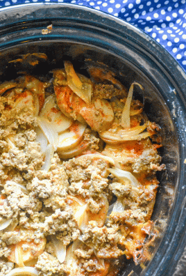 slow cooker au gratin beef and potatoes in the bowl of a crock pot